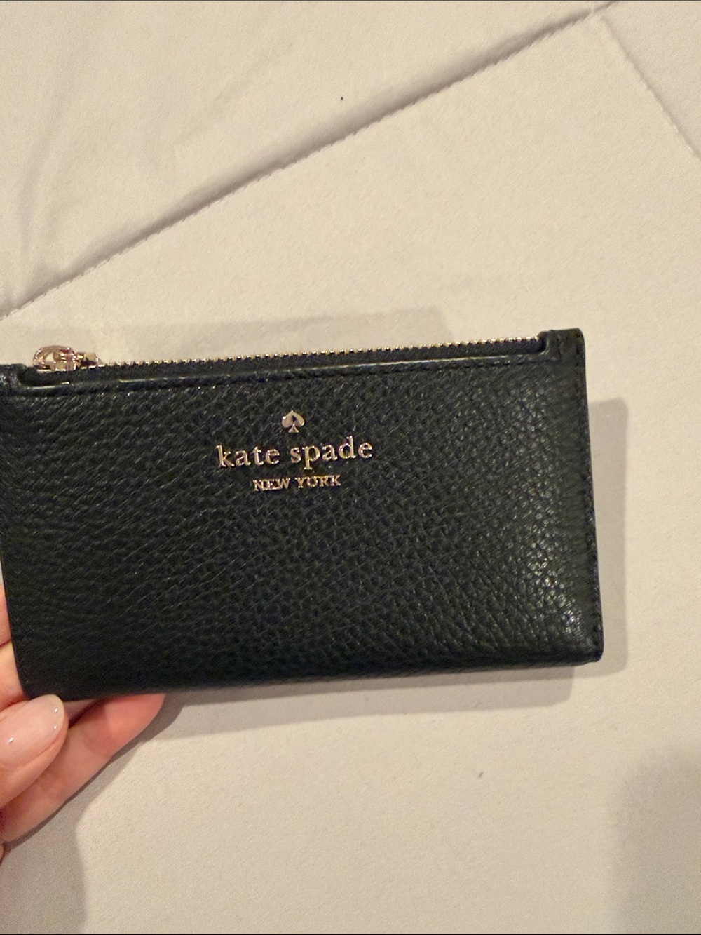 kate spade black pebbled leather zip card case with gold logo